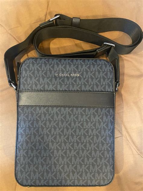 michael kors sling bag black price|michael kors sling bag men.